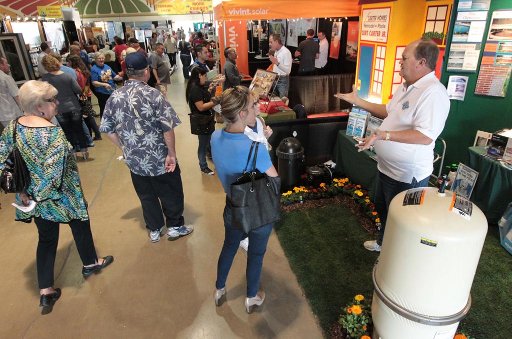 Attendee talking with a local contractor at a Bakersfield Fall Home Show exhibitor booth